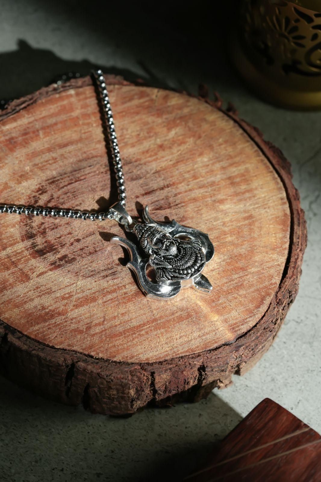 A silver-colored stainless steel chain necklace with a Hanuman pendant