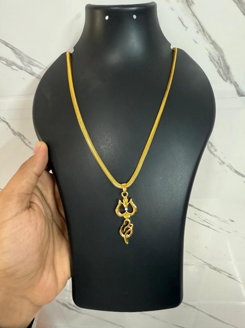 A gold-plated trishul pendant with a chain