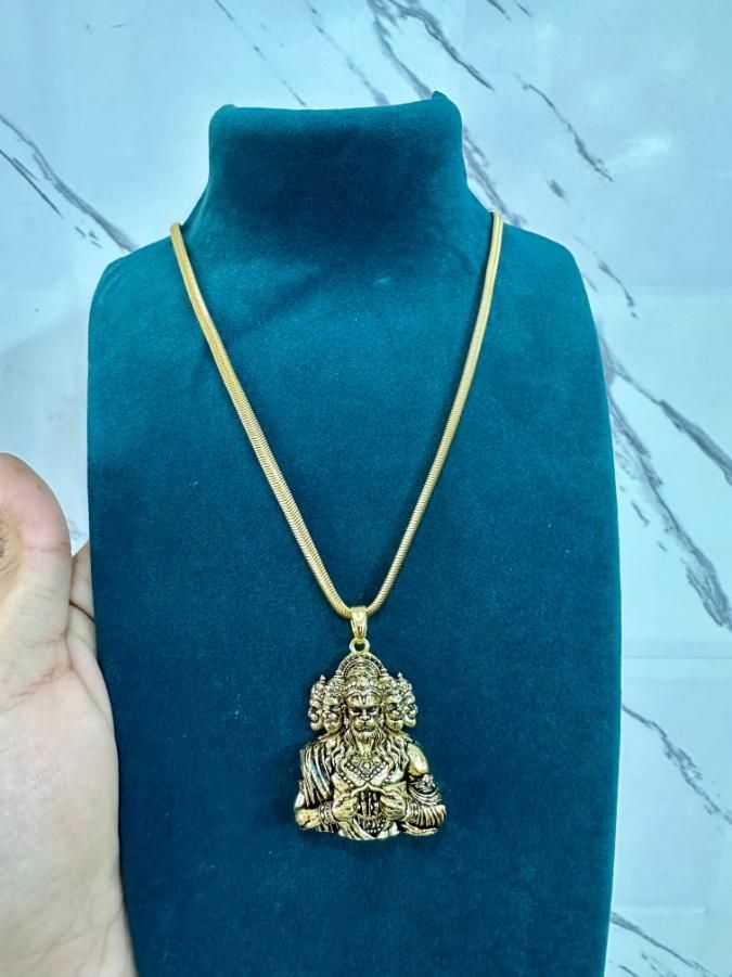 A golden-colored pendant featuring Panchamukhi Hanuman seated in a meditation pose, attached to a golden snake chain