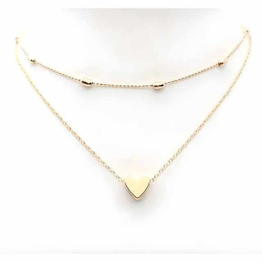 Gold heart-shaped necklace on a white background