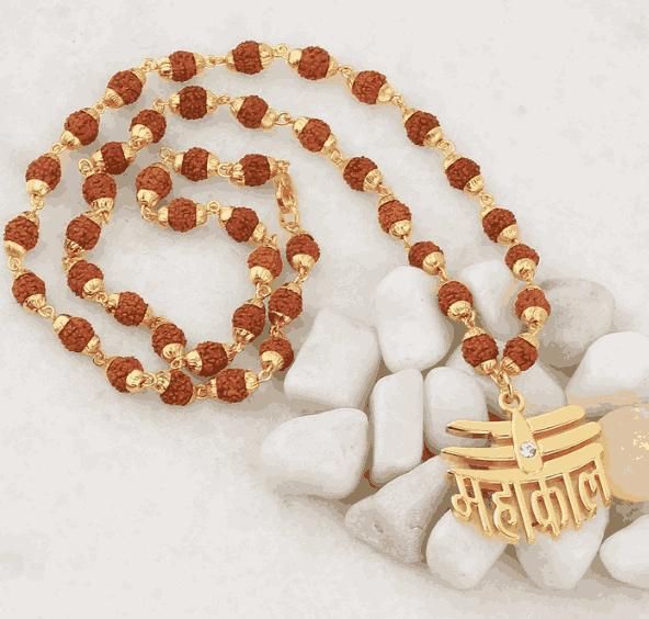 A Rudraksha Mala with red beads and a gold-colored Mahakal pendant